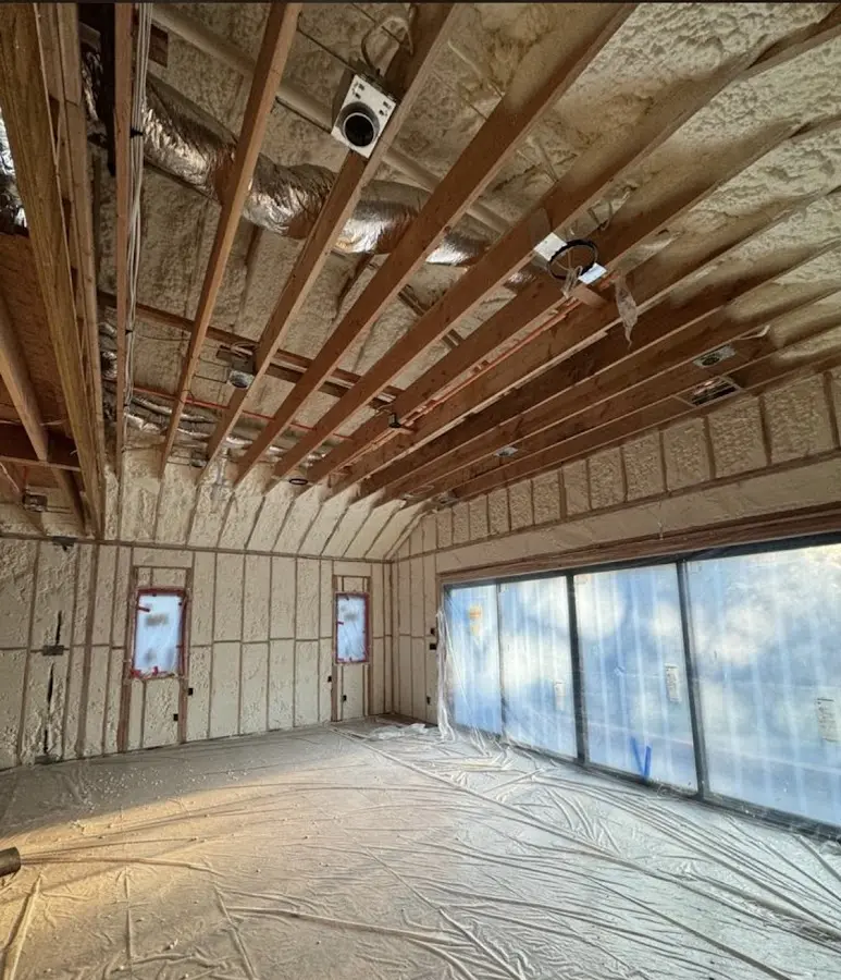 Interior walls and ceiling insulated with spray foam during new construction in Chicago